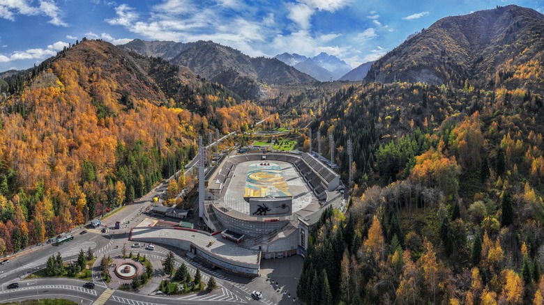 Historic view of Medeu Skating Rink showing the stadium and mountain backdrop