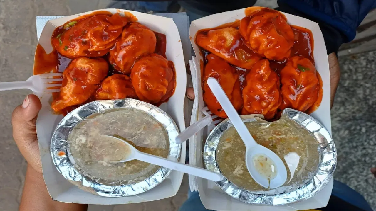 Kolkata street food vendor serving during monsoon rain