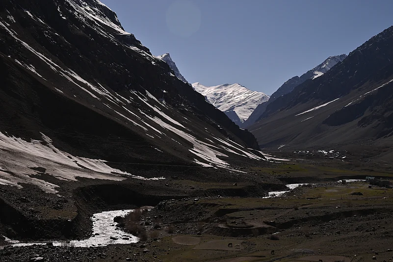 Mushkoh Valley Ladakh with snow capped mountains and green meadows