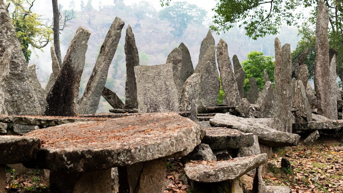 View of Nartiang monoliths collection with temple in background