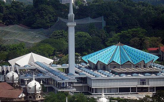 Stunning facade of National Mosque Kuala Lumpur with distinctive blue dome and 16-pointed star roof