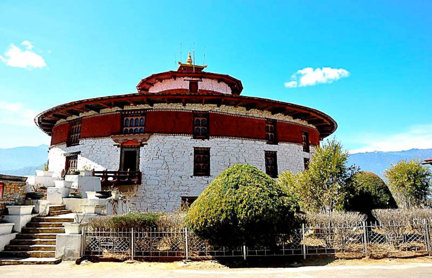 Ta Dzong National Museum Bhutan overlooking scenic Paro Valley with snow-capped mountains