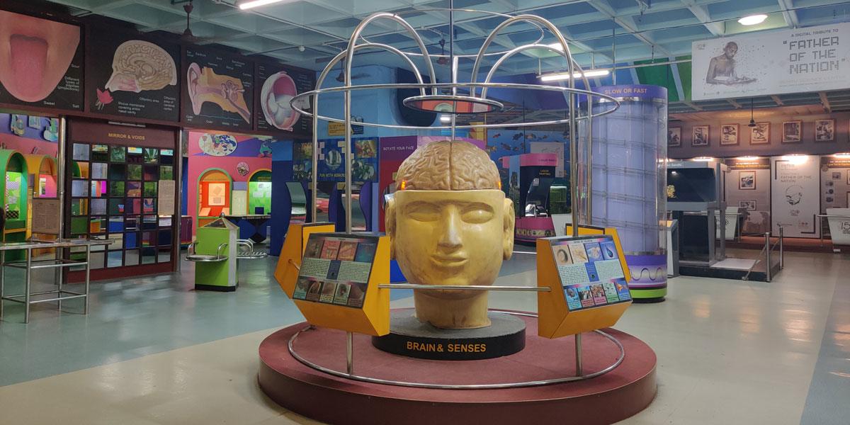 Children interacting with science exhibits at Nehru Science Centre