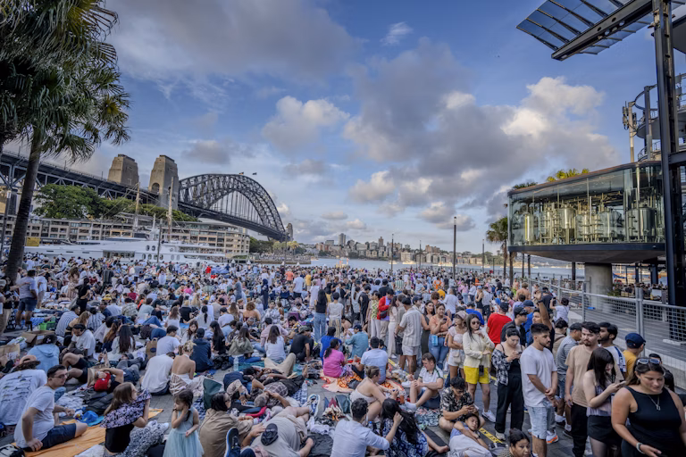 Crowd gathering at Sydney harbour fireworks viewing point