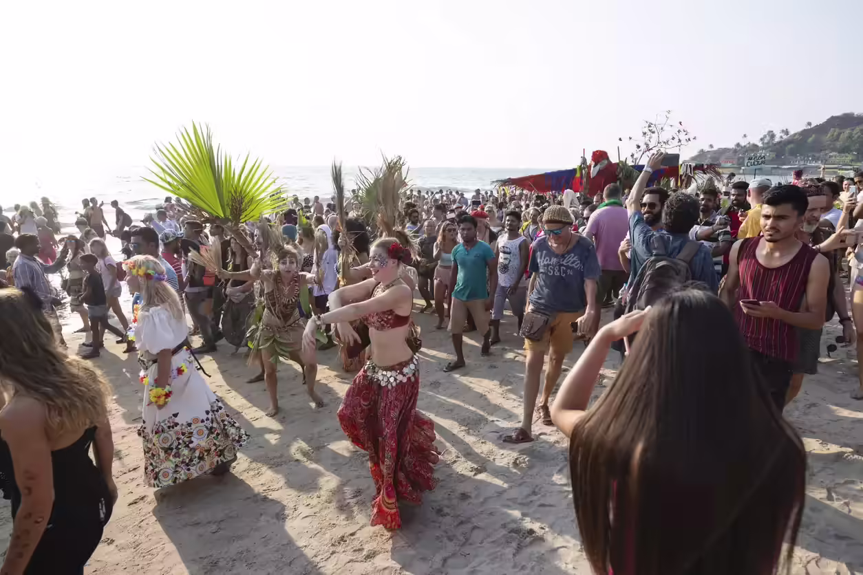 Goa New Year beach party crowd with lights and fireworks