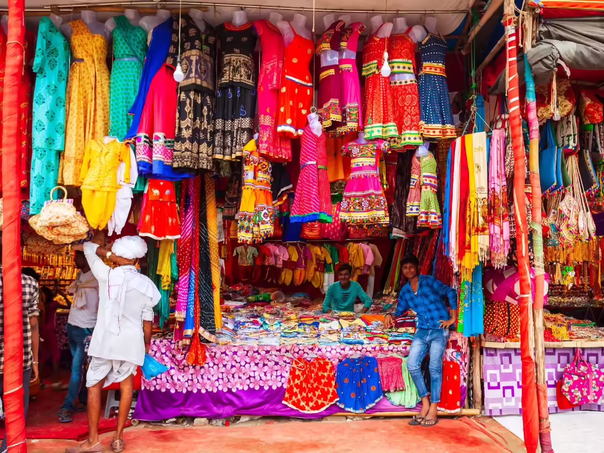 Traveler interacting at a local market in an offbeat Indian town
