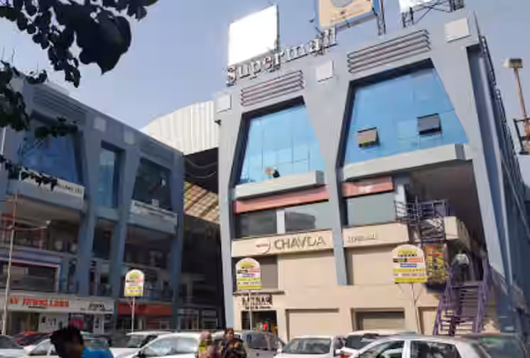 Shopping lane and storefronts near Paldi Char Rasta