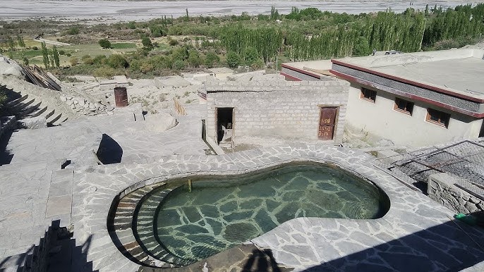 People bathing in Panamik Hot Springs