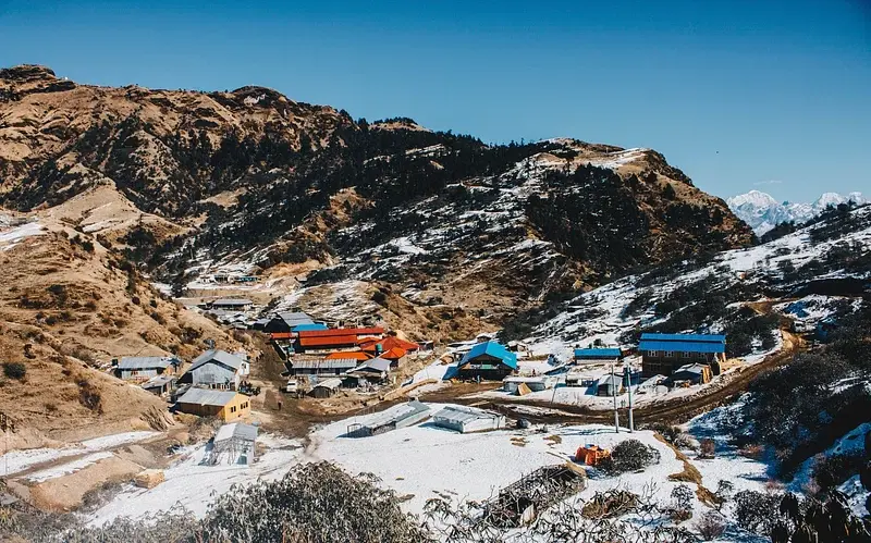 Panamik Hot Springs in winter with steam and snow