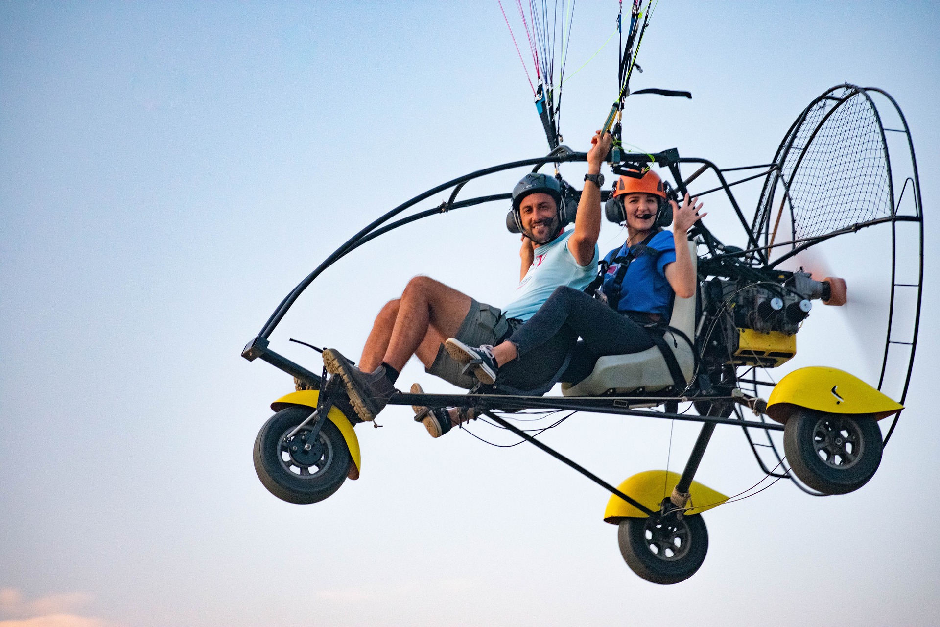 Pilot and tourist during tandem paragliding flight in Kerala