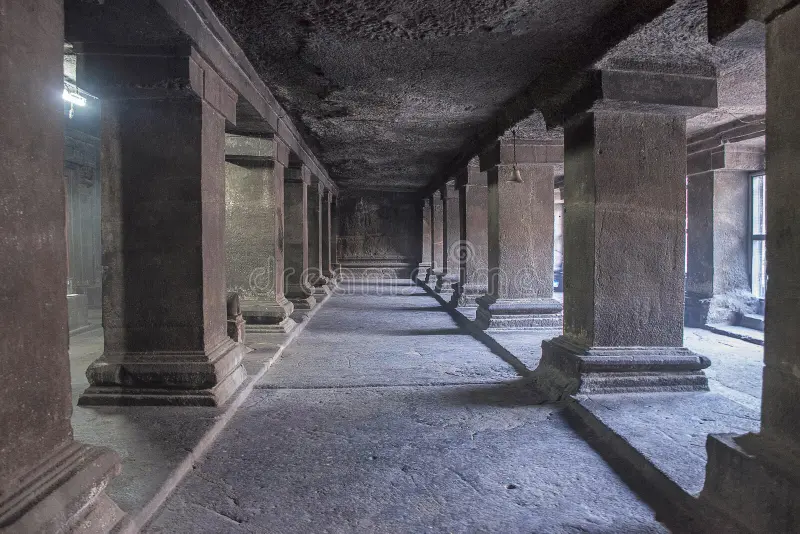 Rock-cut cave pillars inside Pataleshwar Temple