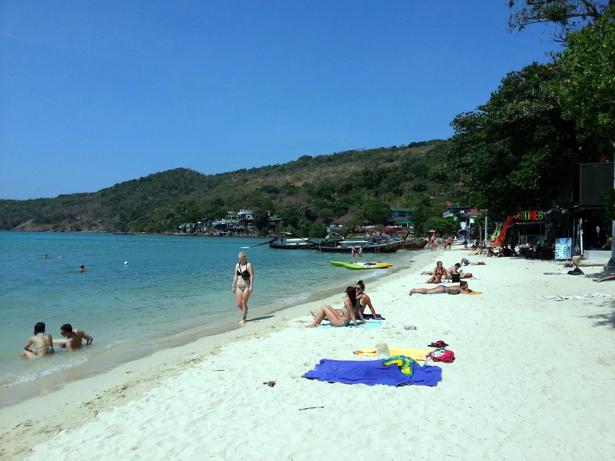 Loh Dalum Beach with restaurants and boats along the shore