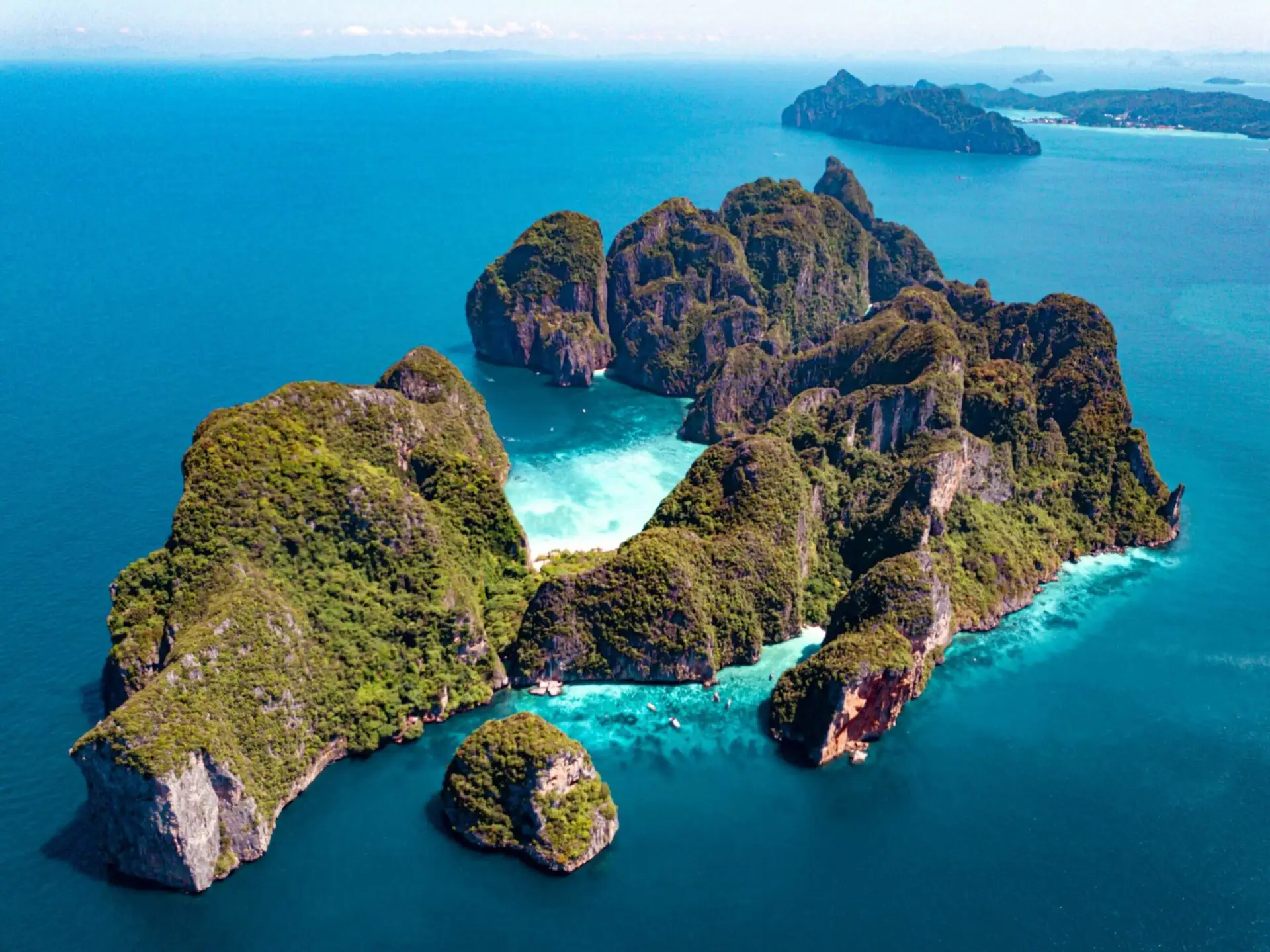 The famous Maya Bay with turquoise waters and limestone cliffs