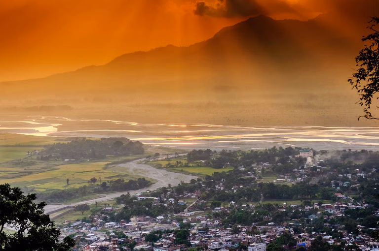 Sunset over Phobjikha Valley with cranes in silhouette