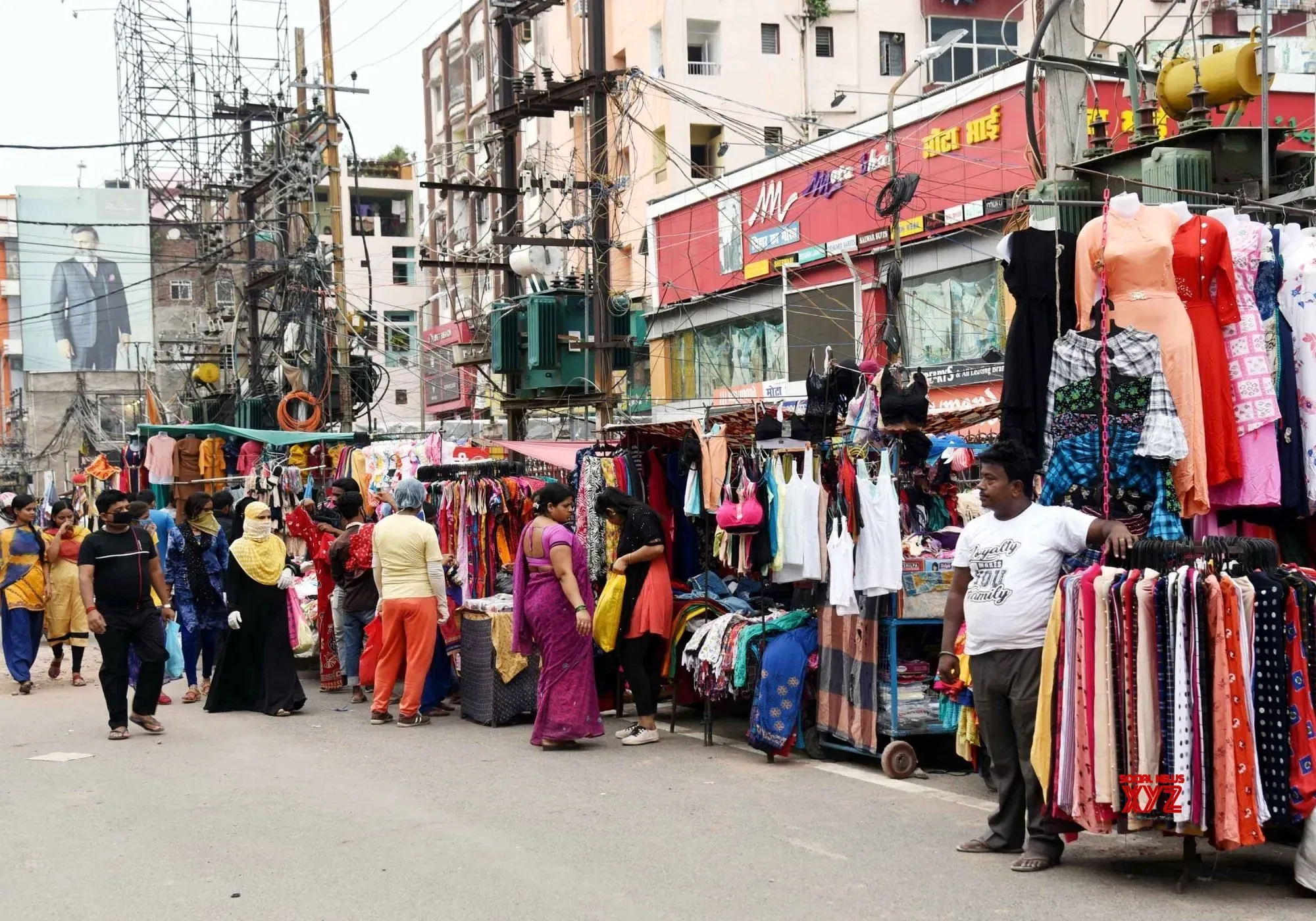 Busy Patna market with shoppers browsing through traditional stalls and shops