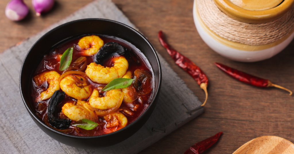 Kerala coastal seafood platter with karimeen and prawns