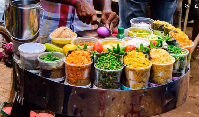 Street food stalls serving mirchi bajji and punugulu in Warangal