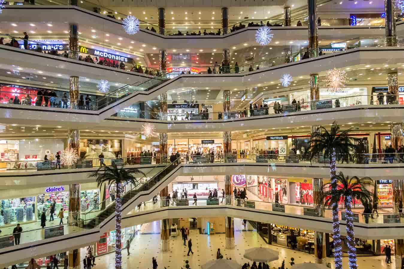 Shoppers walking inside a modern Delhi mall