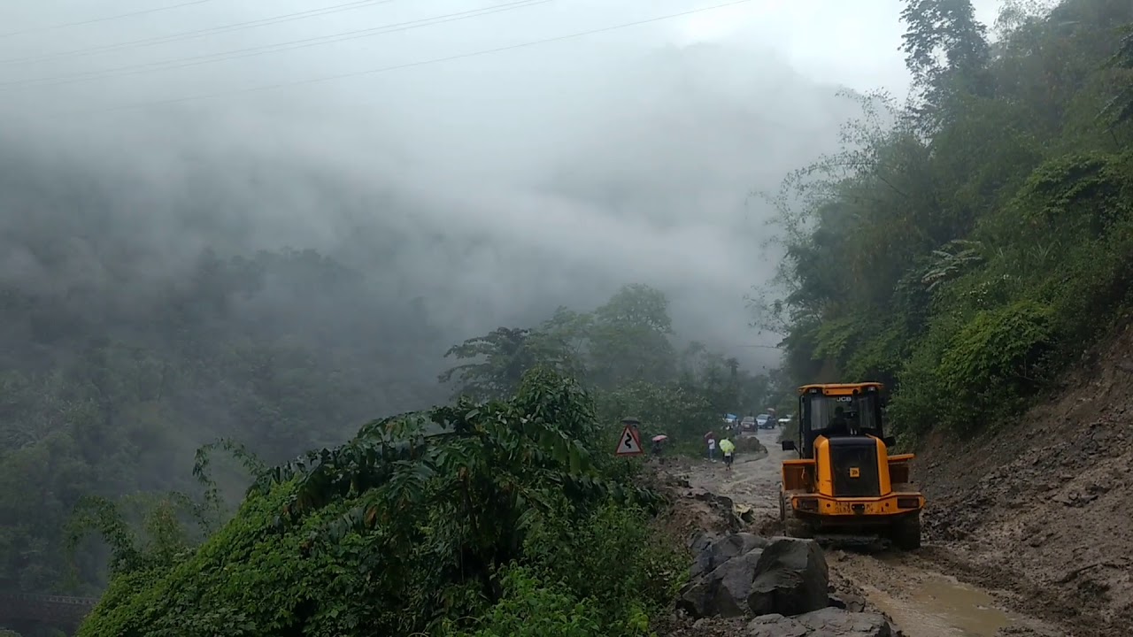 Wet mountain road conditions in Arunachal monsoon