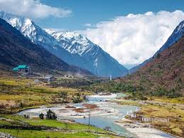 Beautiful Chopta Valley with meadows and snow-capped peaks