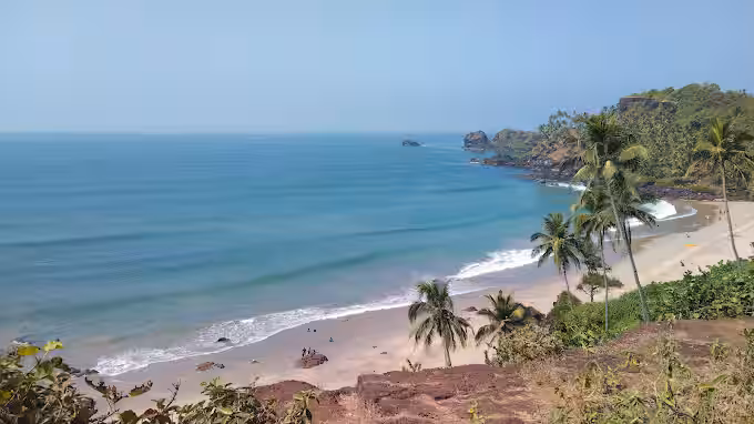 Varca Beach showing quiet shoreline with palm trees