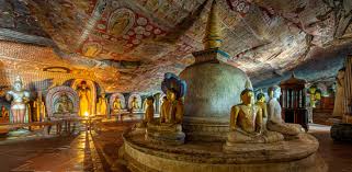Interior of Dambulla Cave Temple showing Buddha statues and paintings