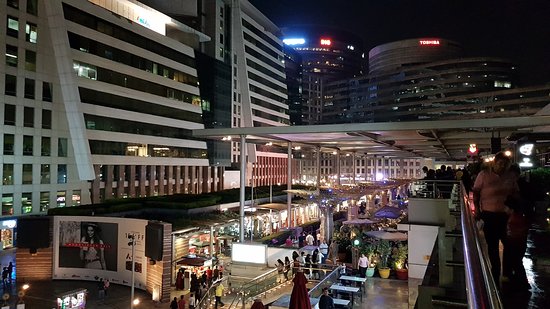 Night ambience at CyberHub Gurugram with illuminated public plaza