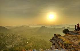 Matanga Hill sunrise overlooking Hampi ruins and boulder terrain
