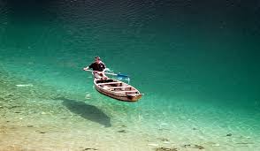 Clear water boating scene on Dawki Umngot River Meghalaya