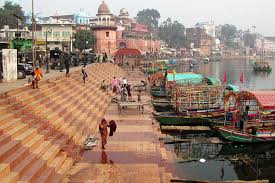 Ram Ghat on Shipra River with devotees performing rituals