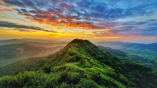 Sunrise trek and fort silhouette at Sinhagad near Pune