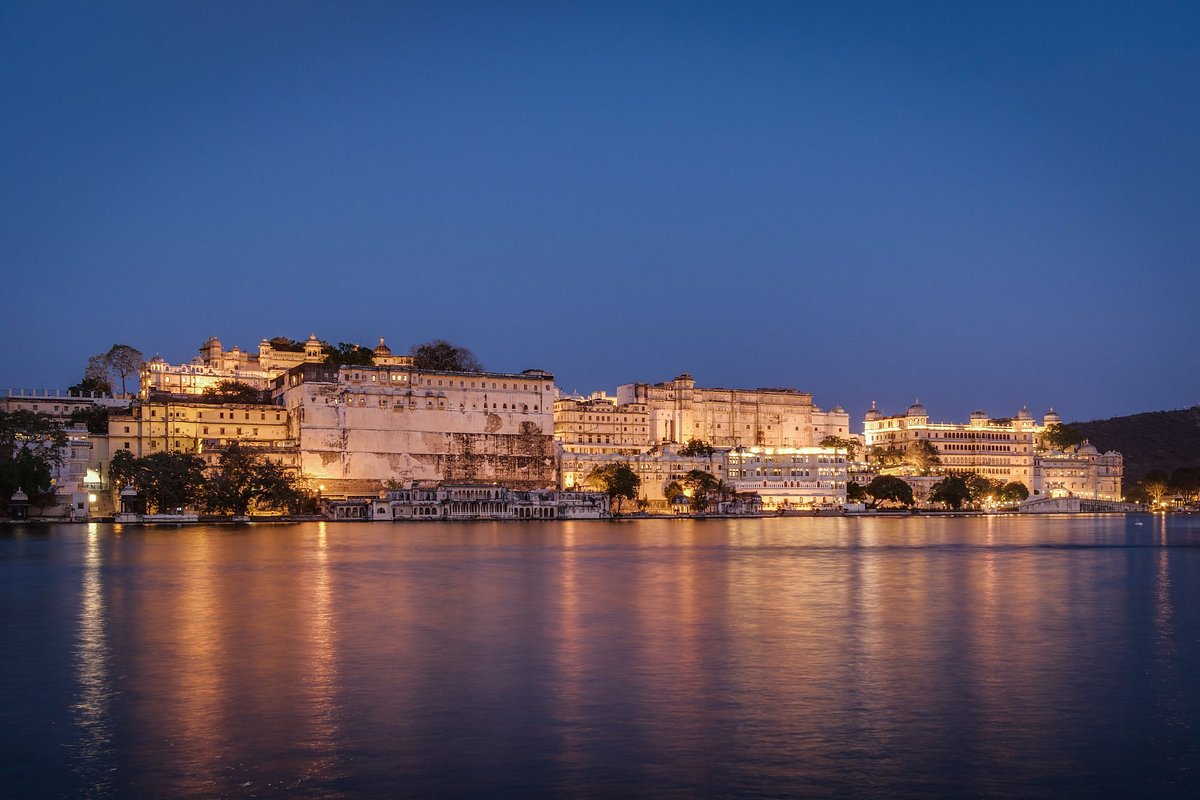 Ambrai and ghat area illuminated at night in Udaipur