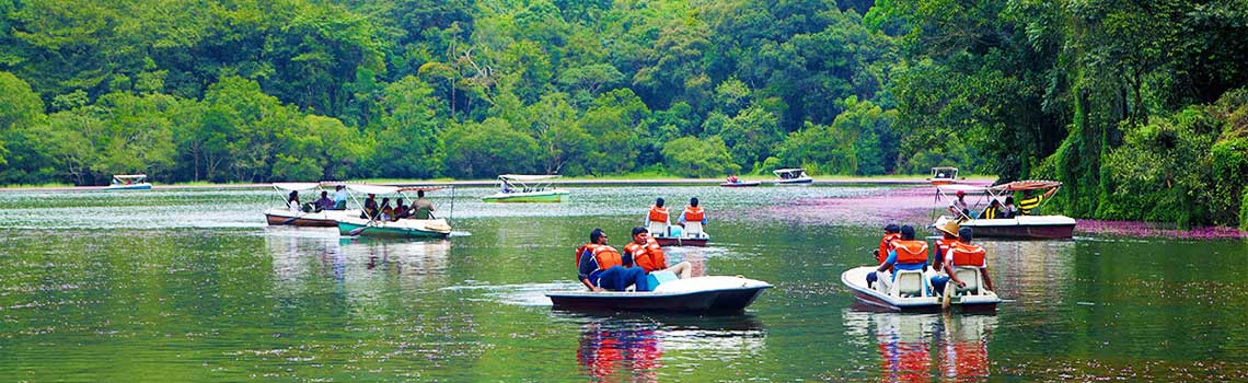 Visitors enjoying boating at Pookode Lake