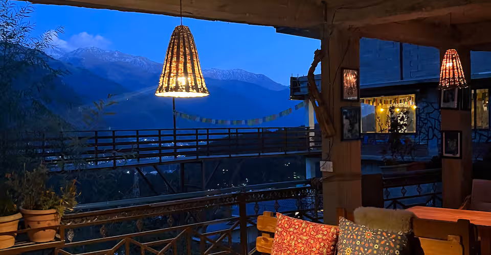 Charming cafe exterior in Old Manali with wooden architecture