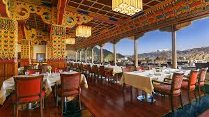 Rooftop restaurant in Leh with mountain views and outdoor seating