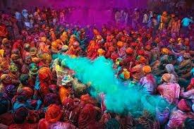 Vibrant Holi celebrations in Rajasthan with people throwing colored powder
