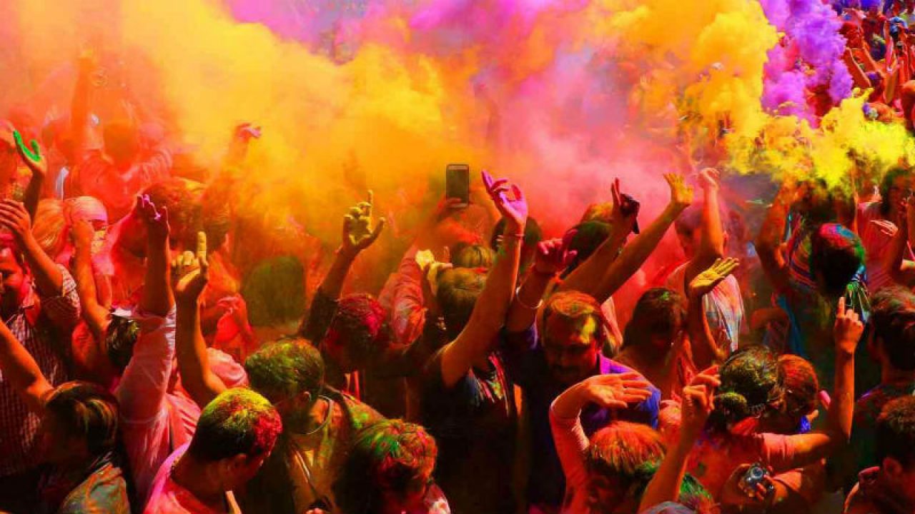 Street Holi celebrations in Jaipur with colored powder and happy people