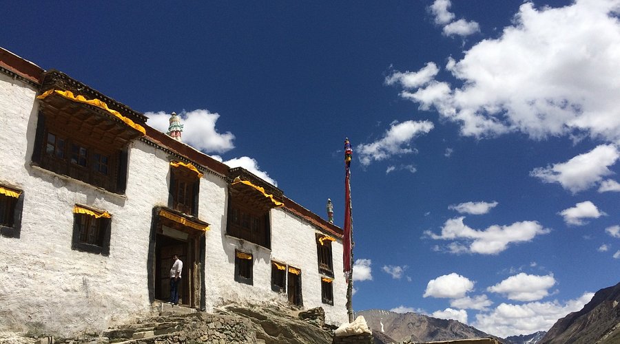 Traditional Tibetan architecture of Rangdum Monastery with prayer wheels