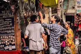 Shoppers browsing through textiles at Rani no Hajiro