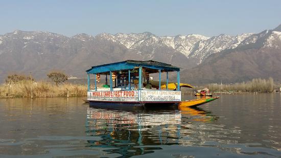 Romantic dinner being served on a traditional houseboat on Dal Lake