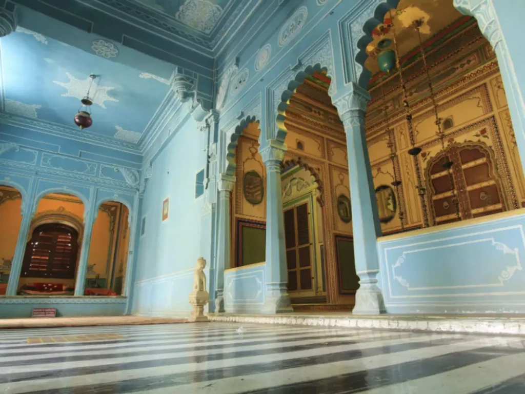 Intricate white marble pillars and corridors