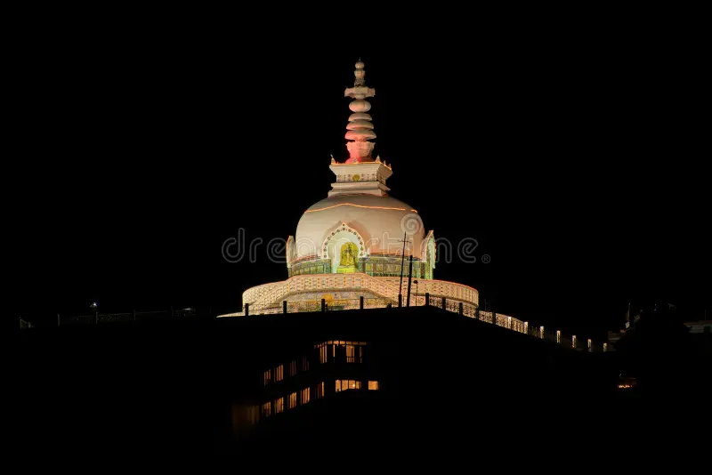 Night view of illuminated Shanti Stupa and Leh town lights