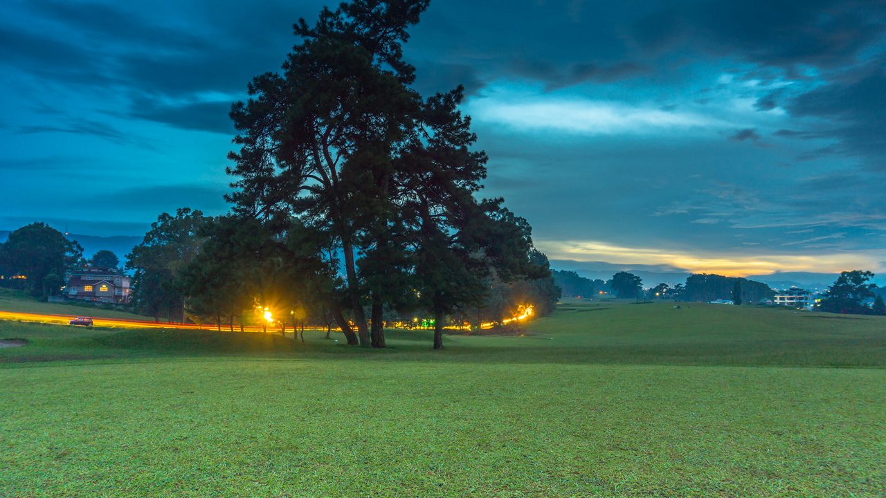Evening light across Shillong Golf Course landscape