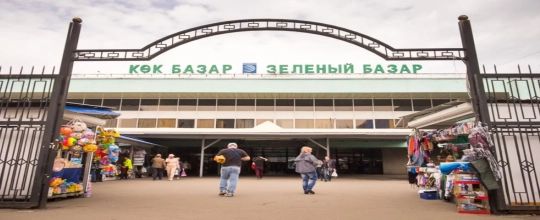 Shopping district and market entry scene in Almaty