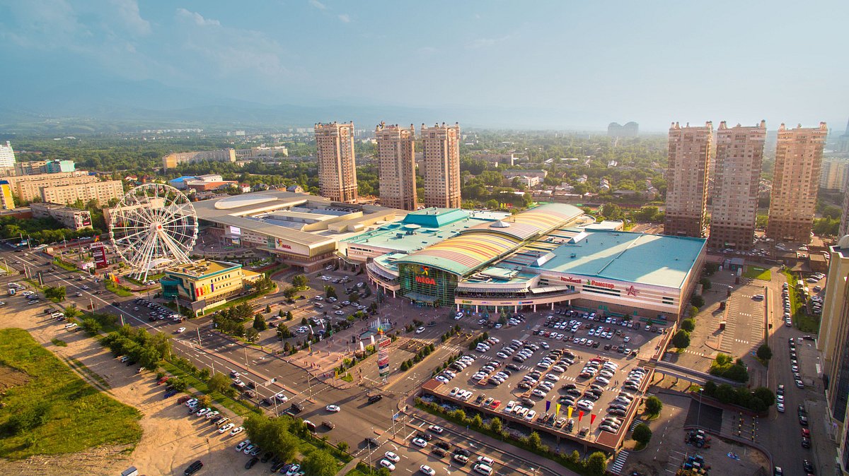 Modern mall and traditional market shopping contrast in Almaty