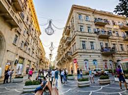 Shoppers and retail storefronts on Nizami Street