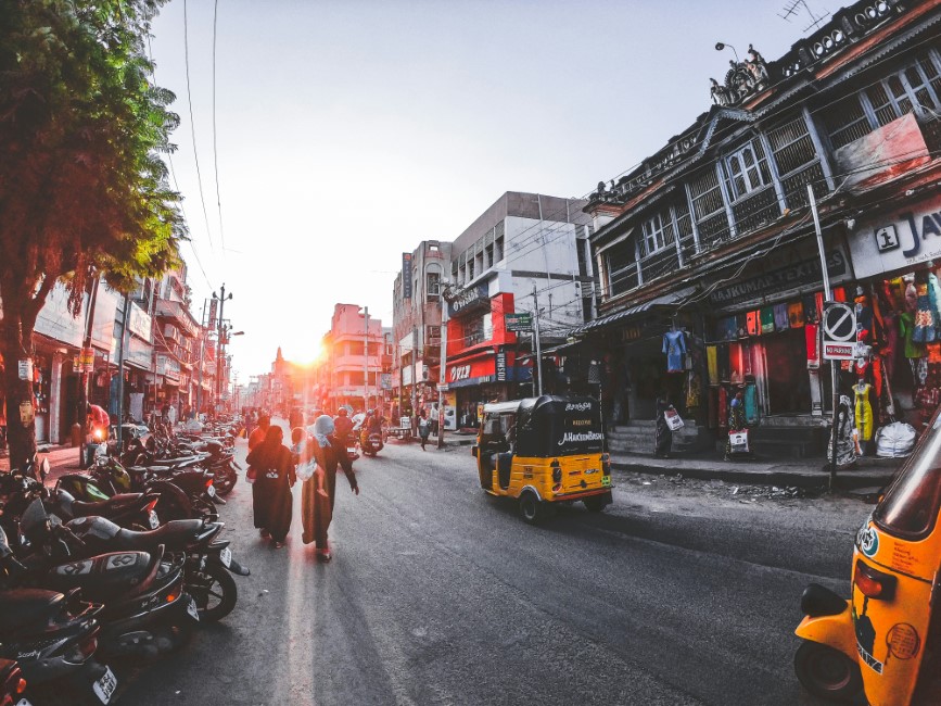 Busy local market street in Madurai with traditional shops