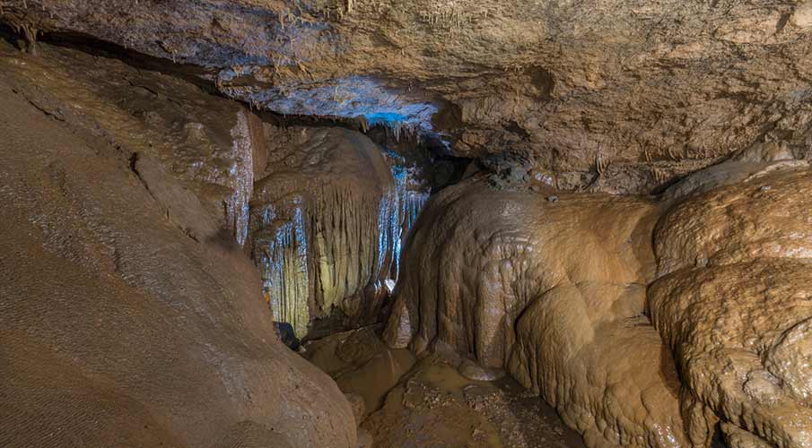 Stalactite and stalagmite formations inside Siju Caves
