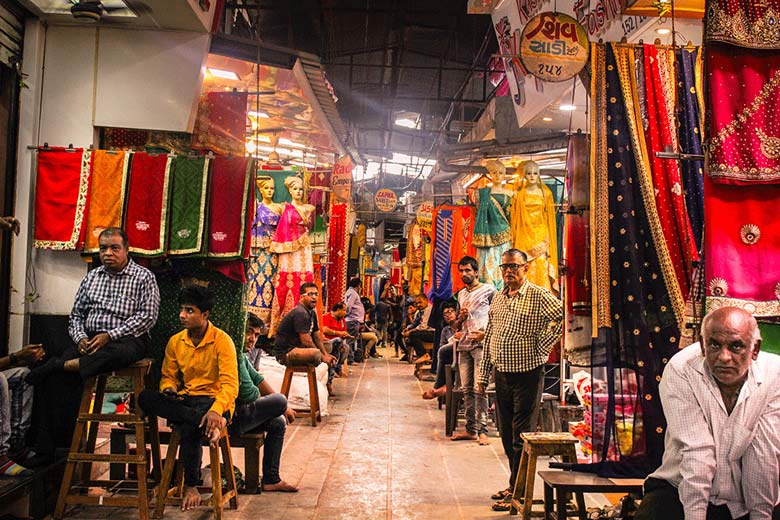 Shoppers walking through Sindhi Market street
