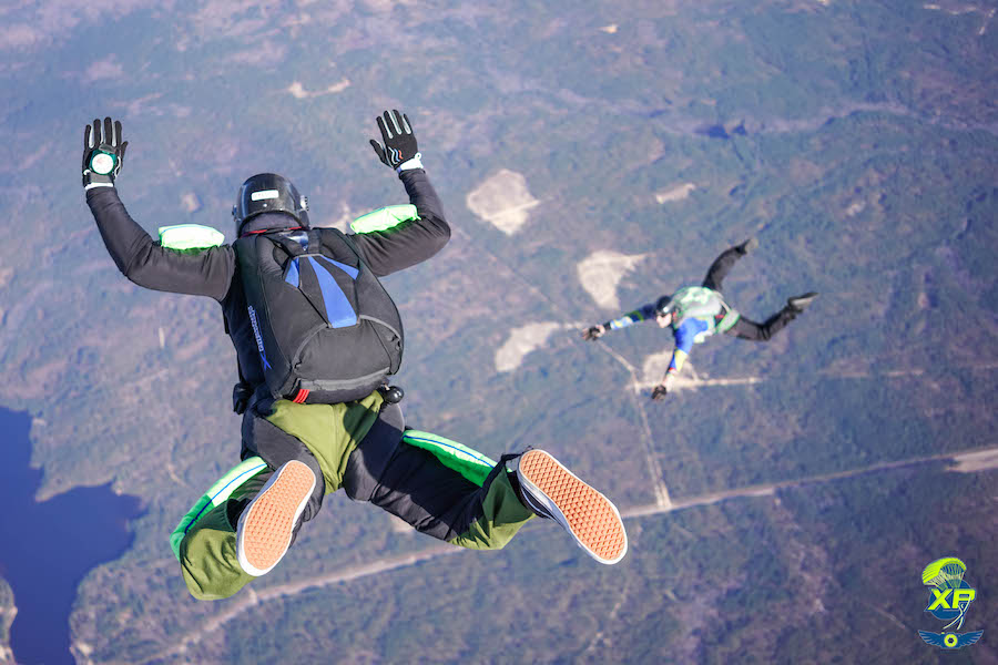 Skydiver in freefall over Thai coastline